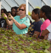 Tara Smith in a greenhouse.